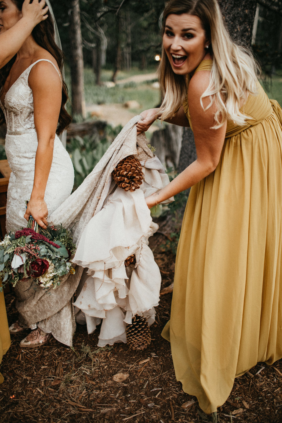 Tahoe Wedding Planners brides dress with pinecone at summer wedding venue Mitchell's Mountain Meadows Sierraville near Truckee, Joy of Life Events image by Lukas Koryn