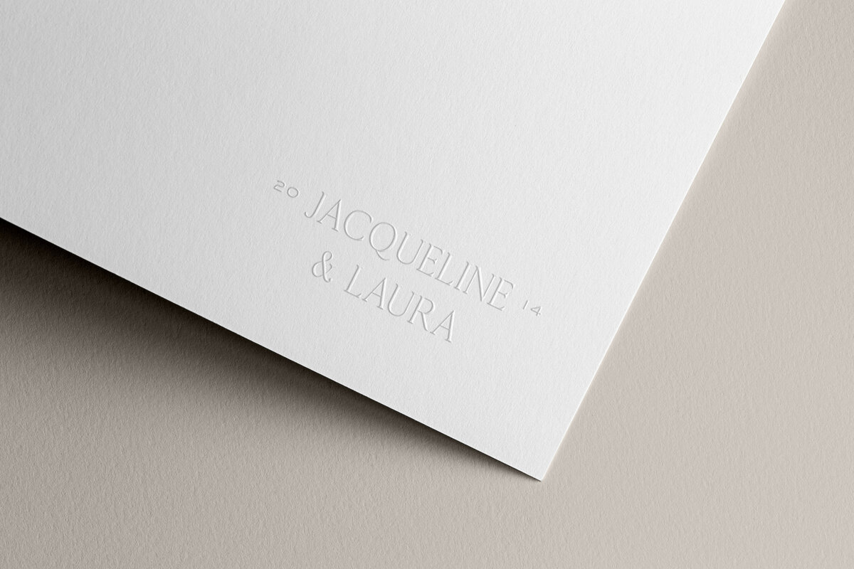 a mockup showing an elegant logo embossed on stationery