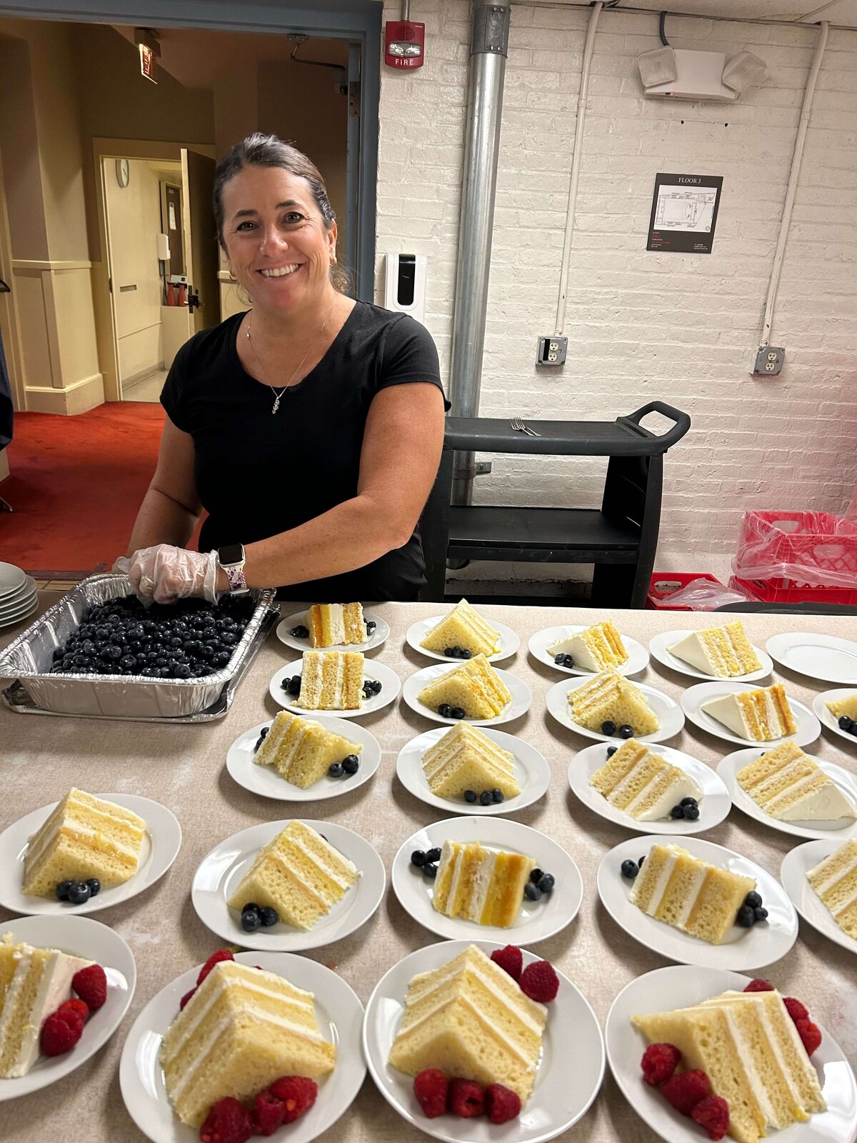 staff-prepping-cake-and-berries
