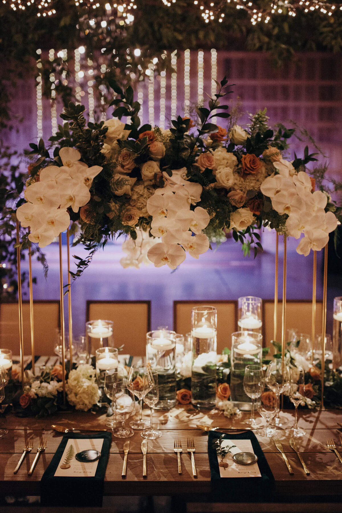 Floating candle centerpieces with white orchids