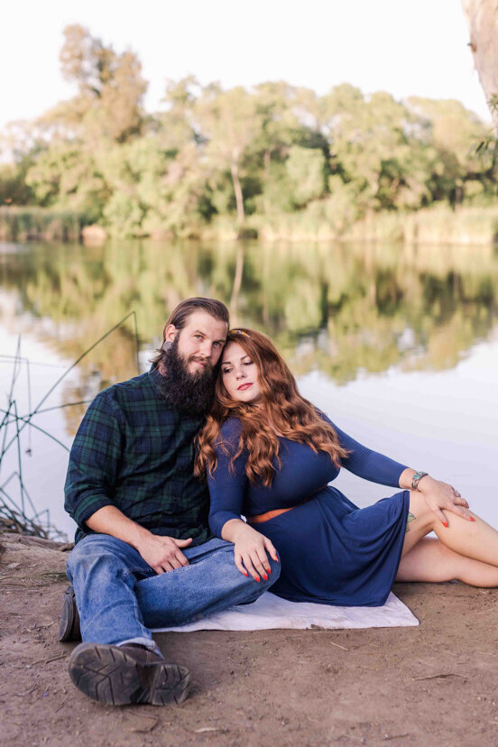 couple-sitting-by-morrison-pond-bonita-san-diego