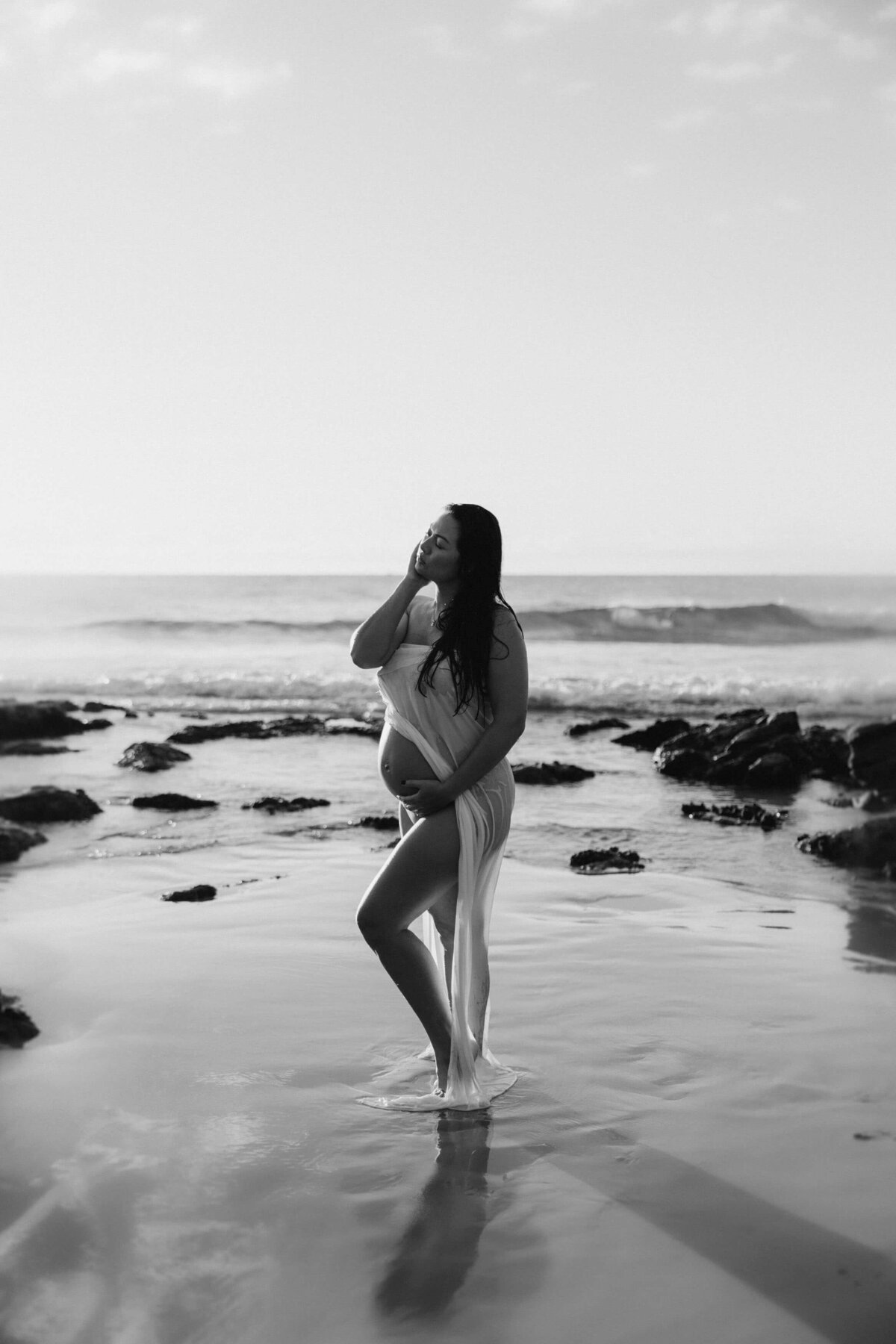 pregnant woman standing in the sea