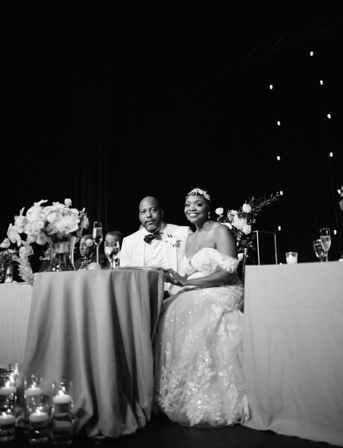 bride and groom at sweetheart reception table, Garden Theater wedding reception, Detroit wedding photographer Christina Harrison 