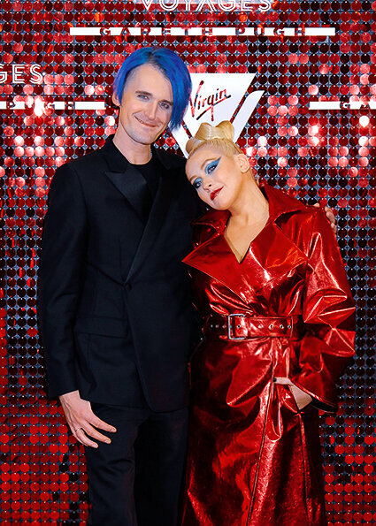 Gareth Pugh and Christina Aguilera pose at a Virgin Voyages event party in London