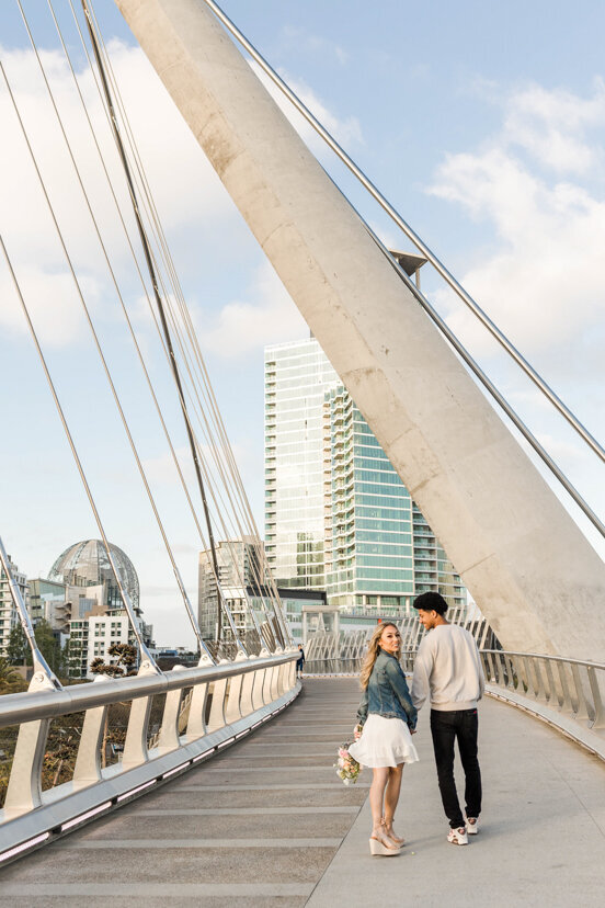couple-walking-on-bridge-downtown-san-diego