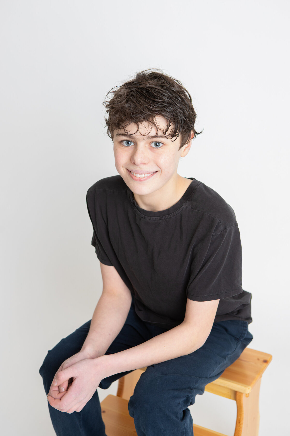 Young actor sitting headshot