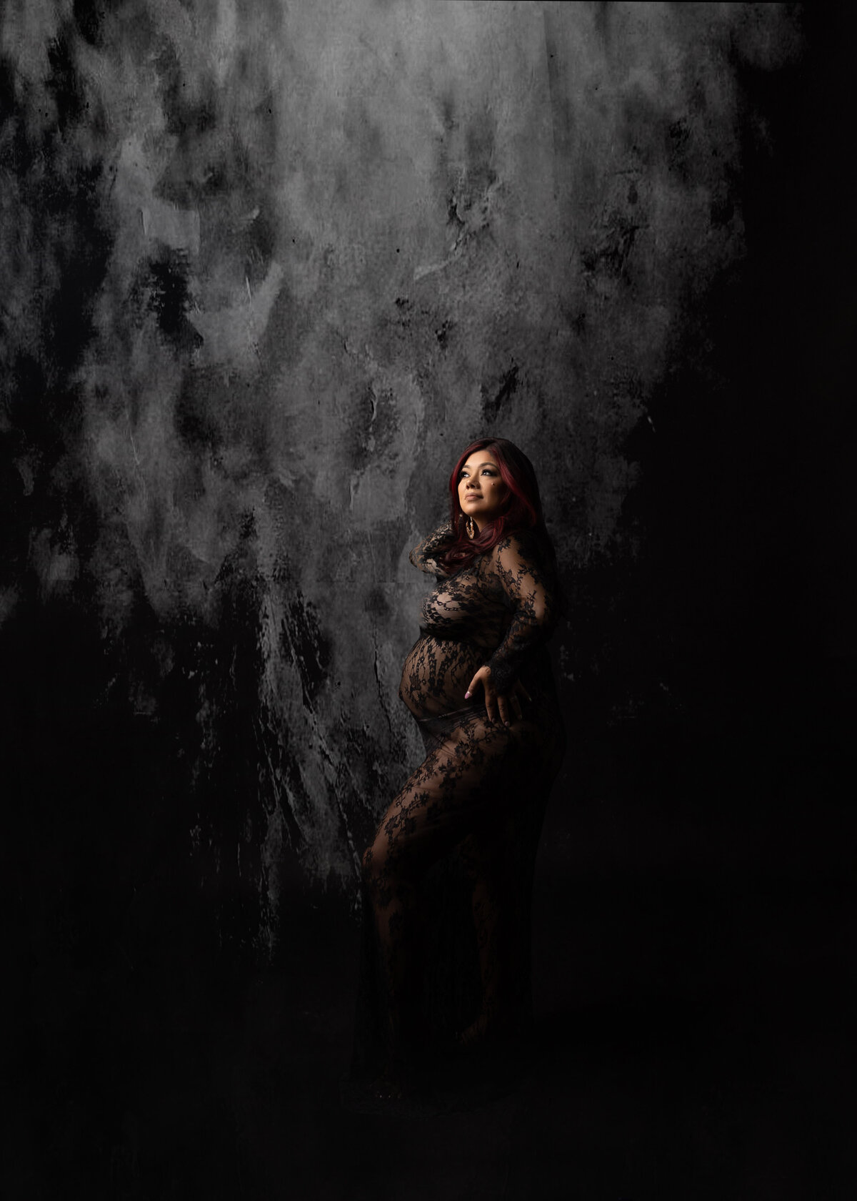 Stunning studio maternity session mom wearing a lace bodysuit