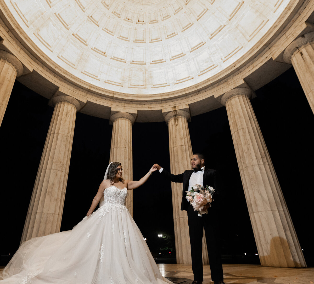 bride and groom dancing at the world war two memorial in washungton dc by wedding photographer Amanda Richardson Photography