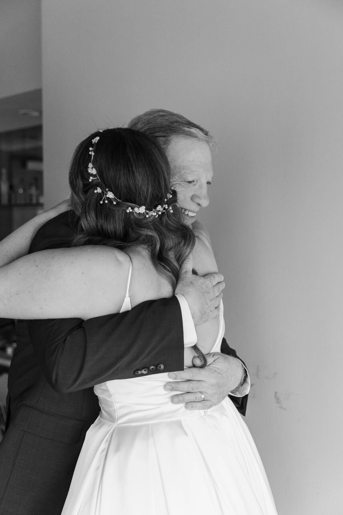 The bride does a first look with her father at The Roundhouse bridal suite