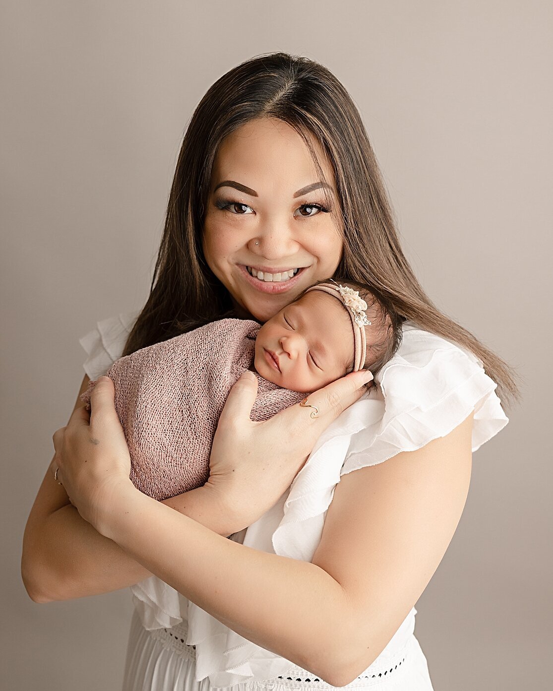 beautiful mom holding baby girl in hillsboro newborn pictures