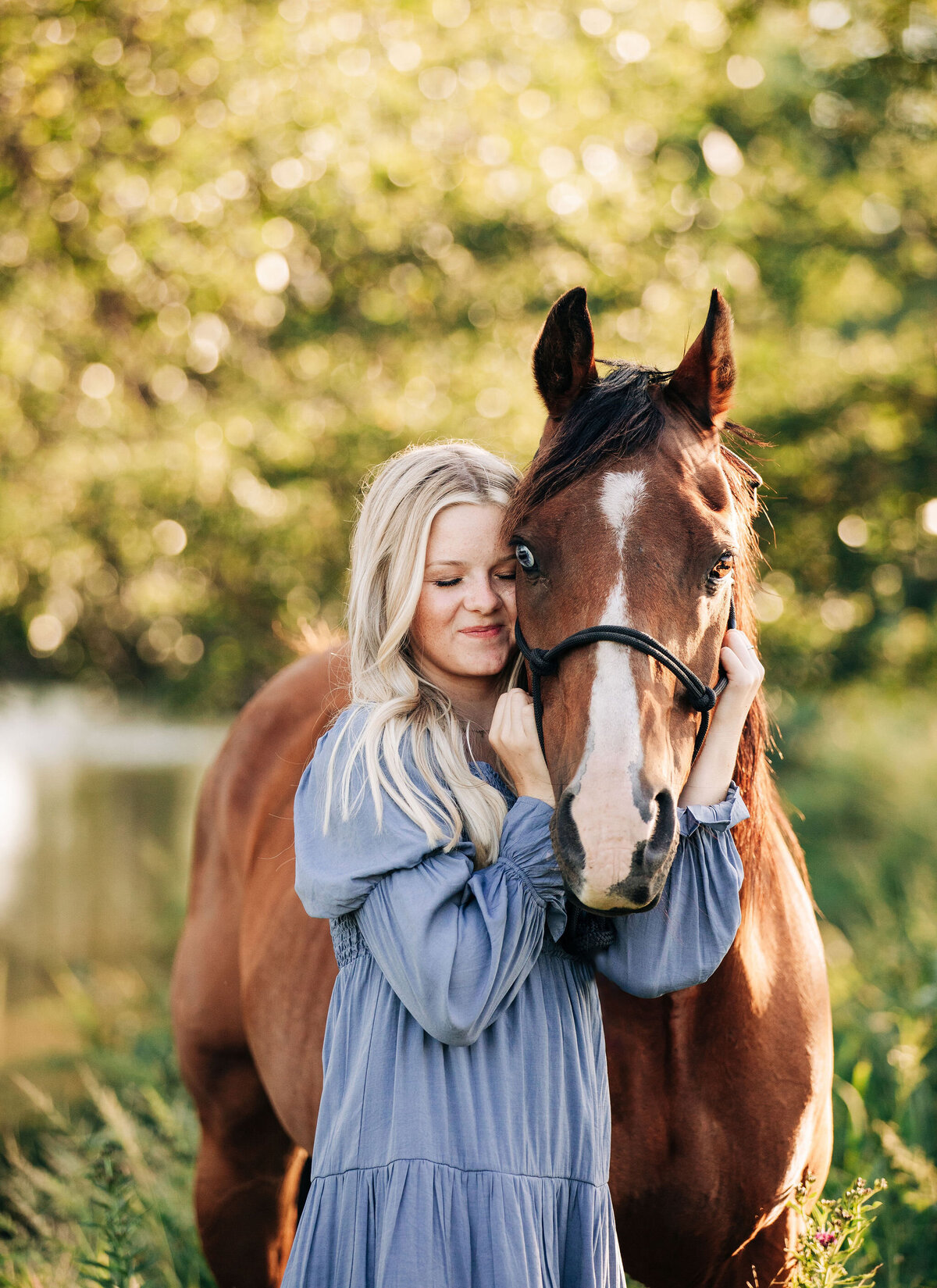 senior session with girl in blue dress with horse