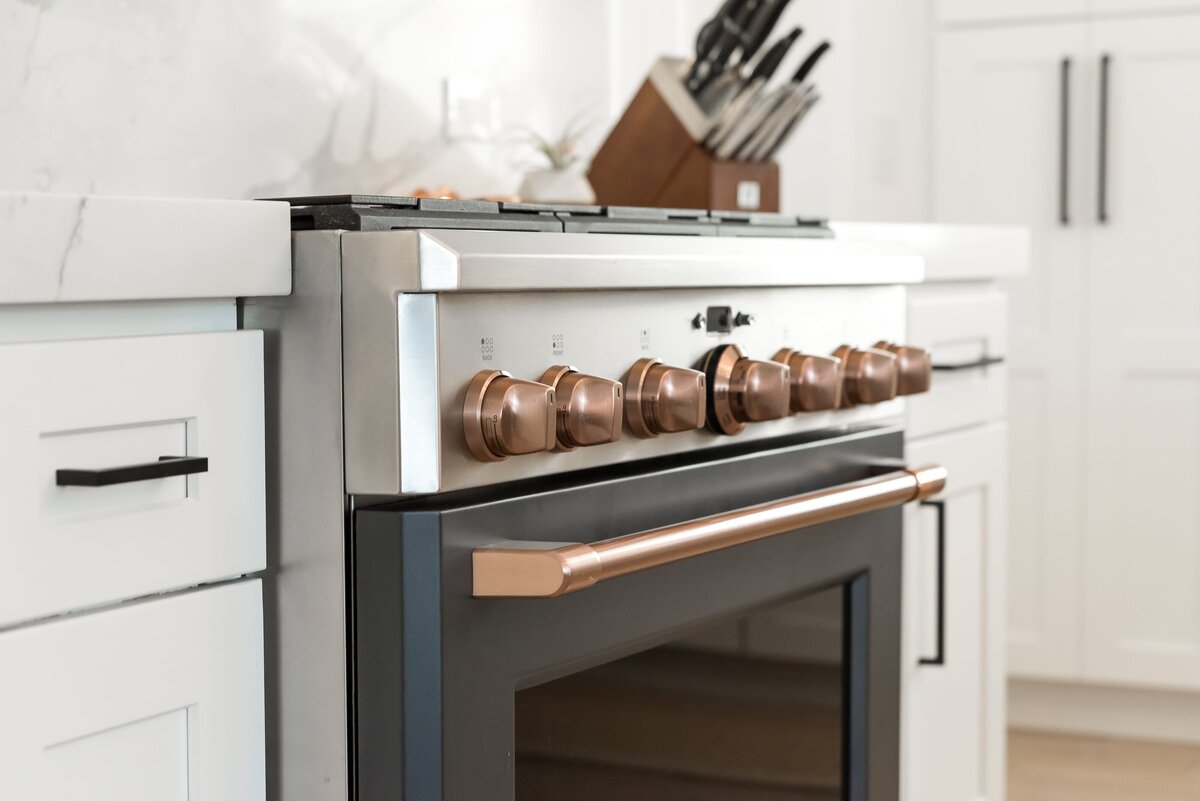dewine design orlando interior designer modern lakehouse kitchen oven with copper nobs and handle