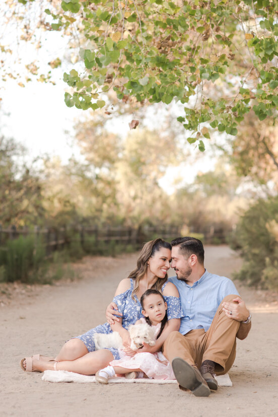 family-sitting-on-path-with-dog-Bonita-San-Diego