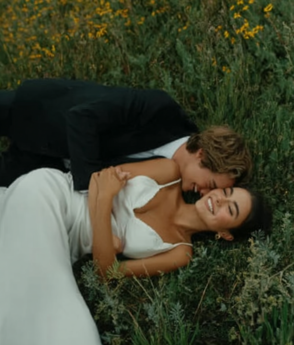 u8487914977_a_bride_in_a_white_wedding_dress_lies_on_her_back_59094872-78e8-4e22-b180-049c0f1a5224_3