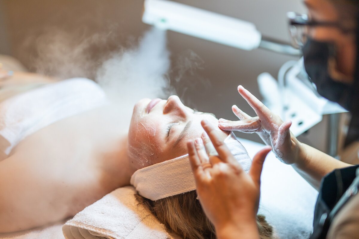 Girl having her facial done by Rachel Smith with a face mask in a spa in Canfield, Ohio.