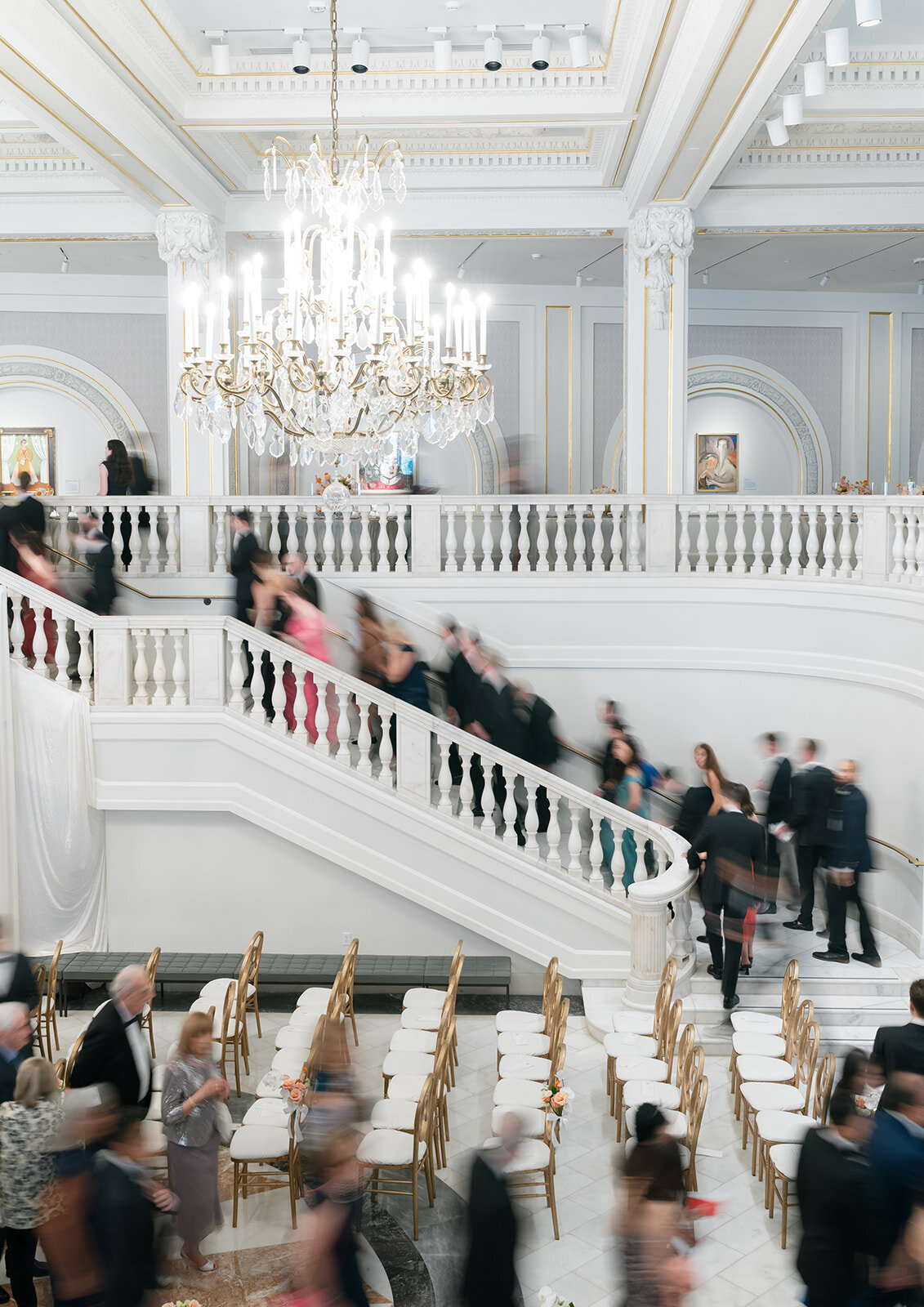 Guess heading up the stairs to cocktail hour at the National Museum of Women in the Arts. 