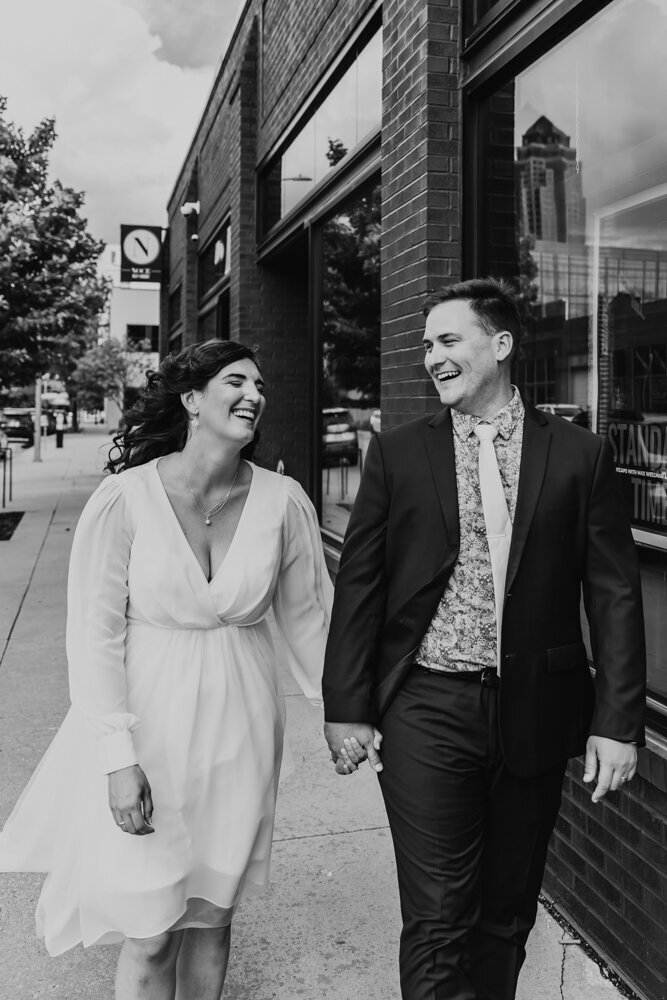 couple-walking-and-laughing-noce-des-moines-wedding-photographer-storyteller-collective-photo-co
