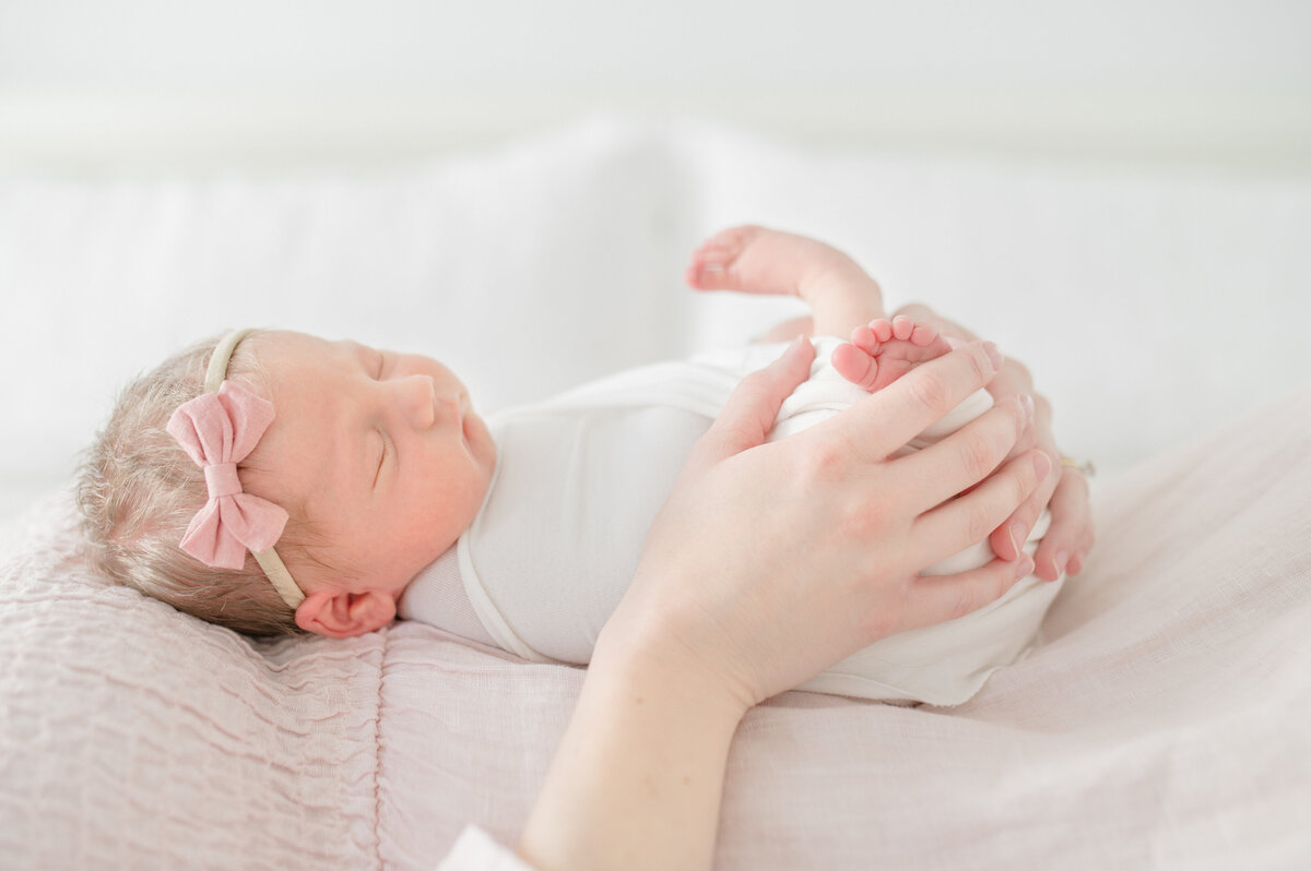 baby-girl-snuggling-mom
