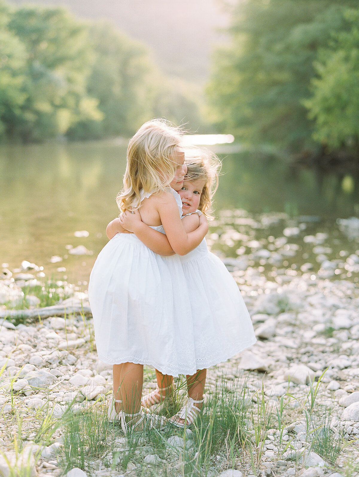 Two little girls in white dresses