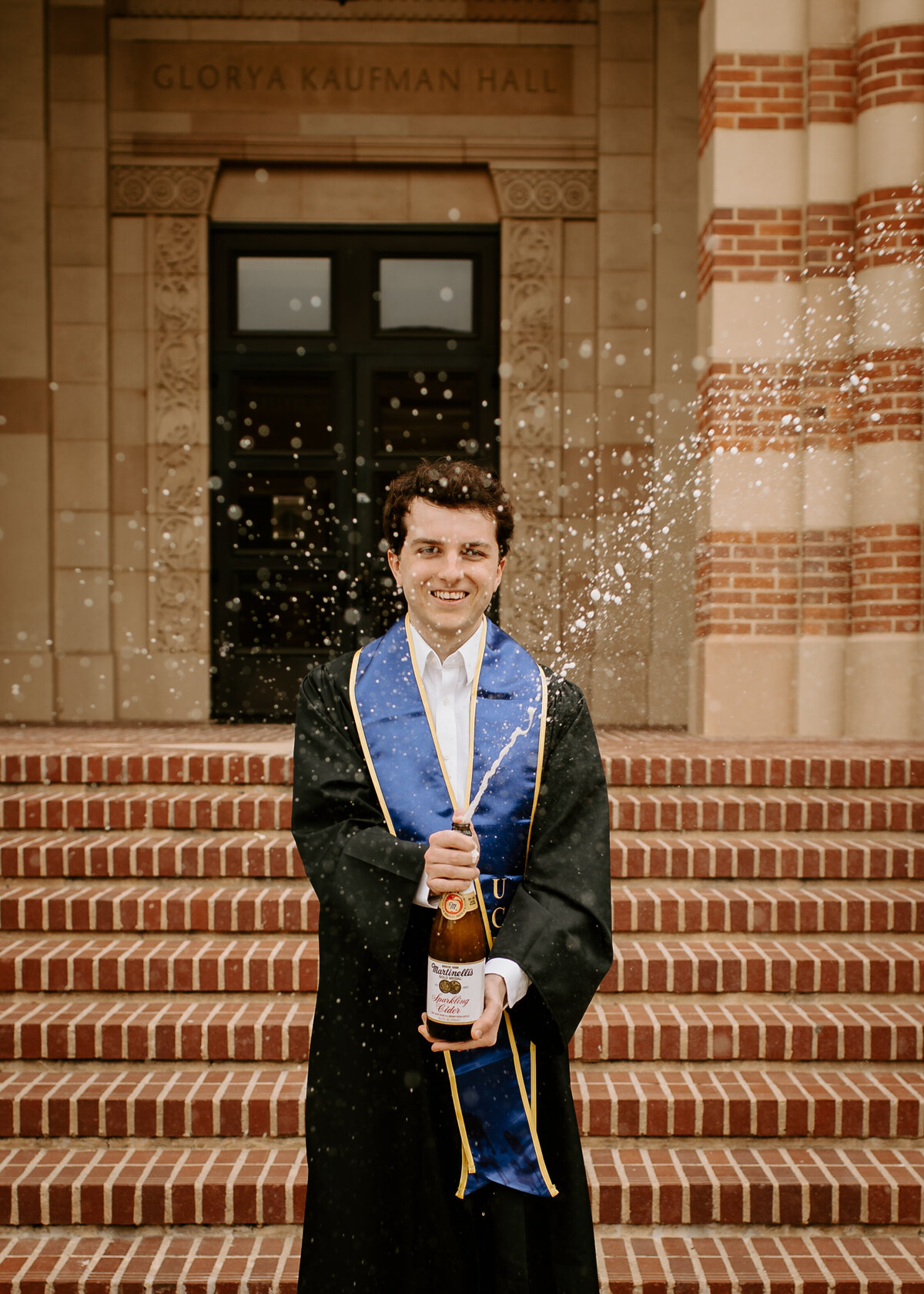 champagne spray during senior photos