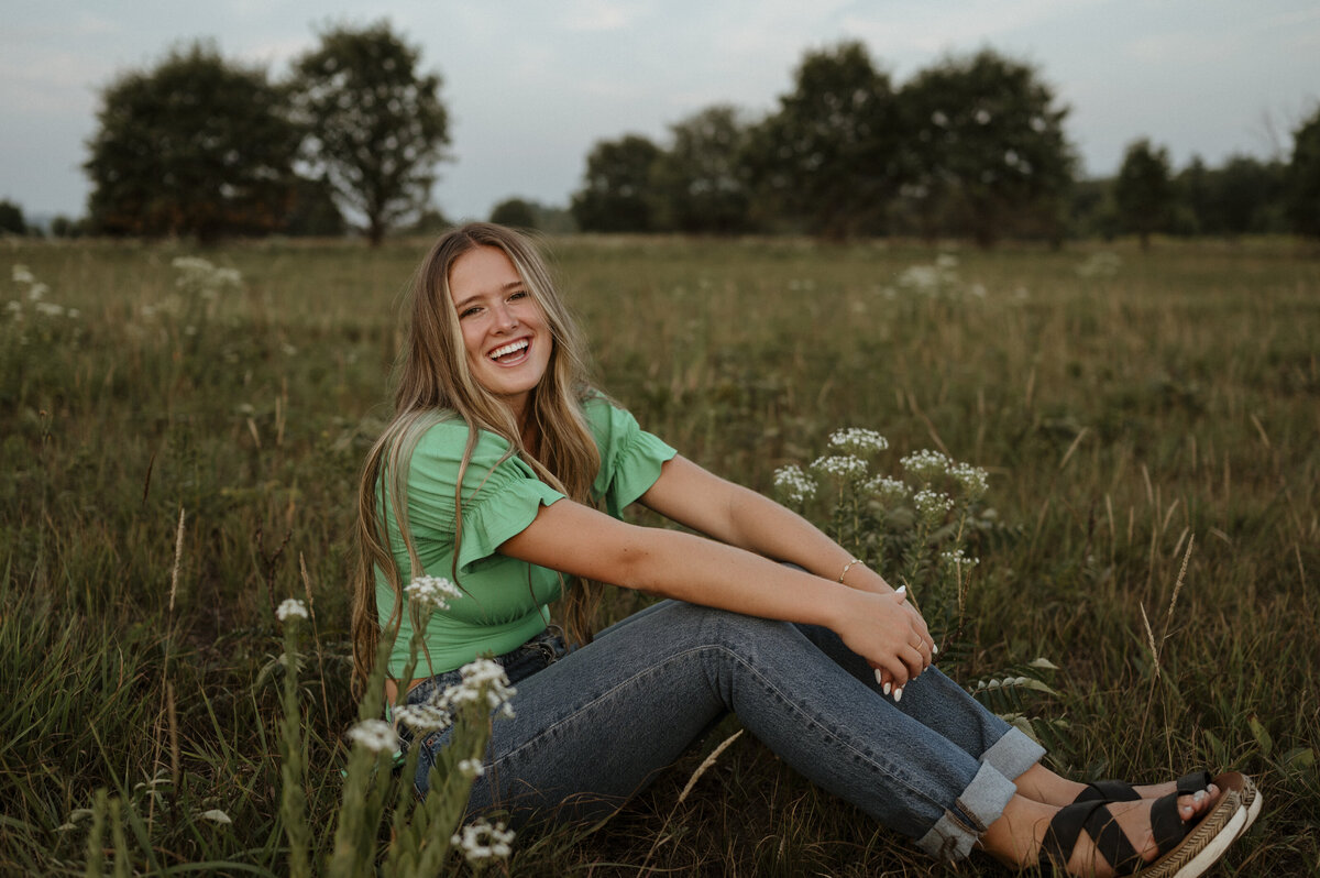 Girl laughing in flower field