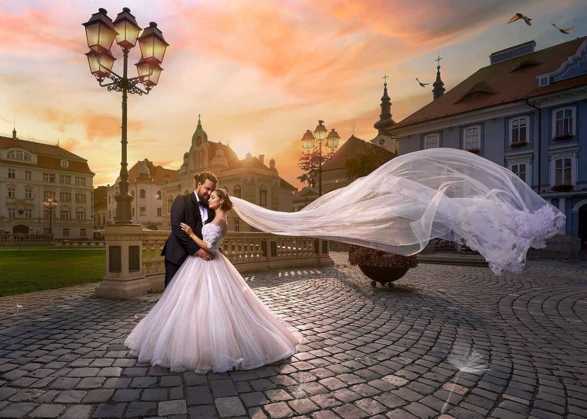 Groom and Bride hugging at the sunset.