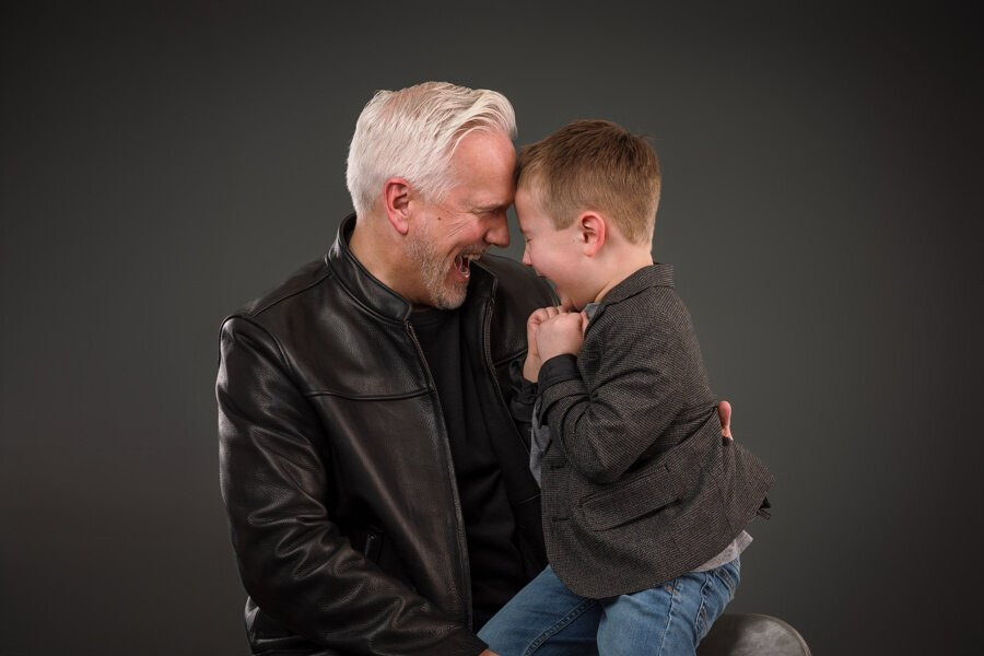 A father and son laughing