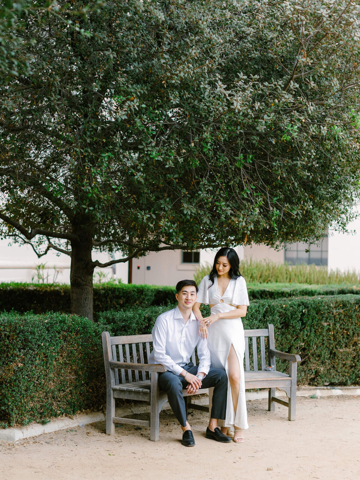 couple sitting on a bench at the pasadena city hall