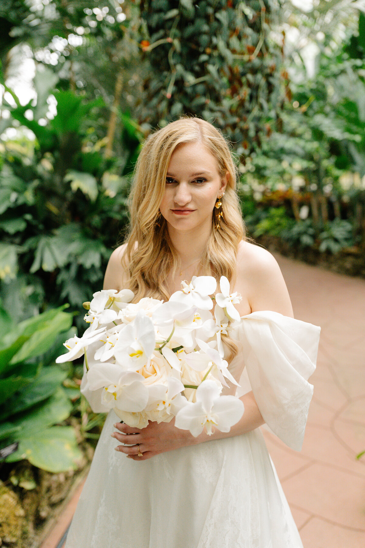 white orchid only bride bouquet