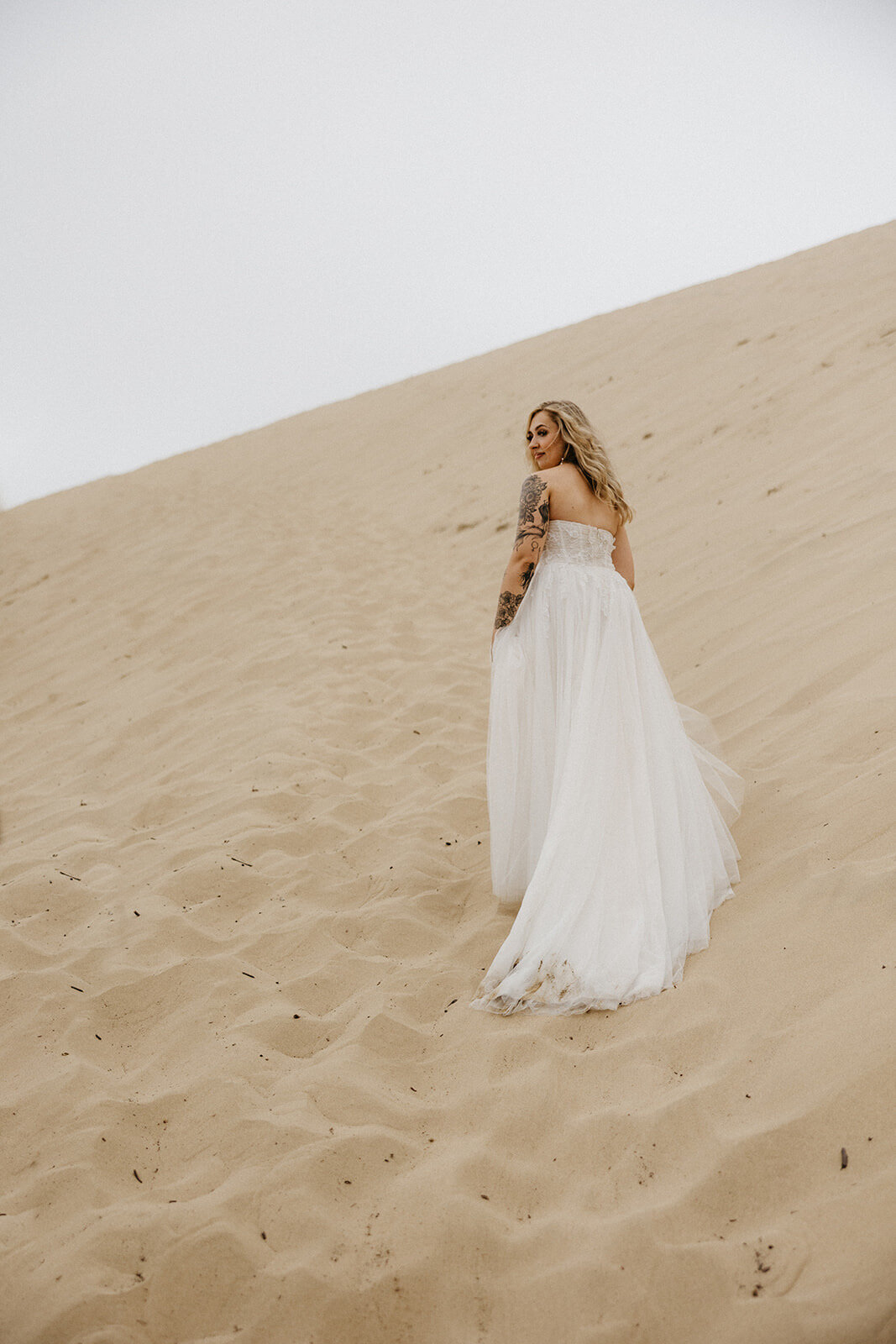 bride on beach in wedding dress
