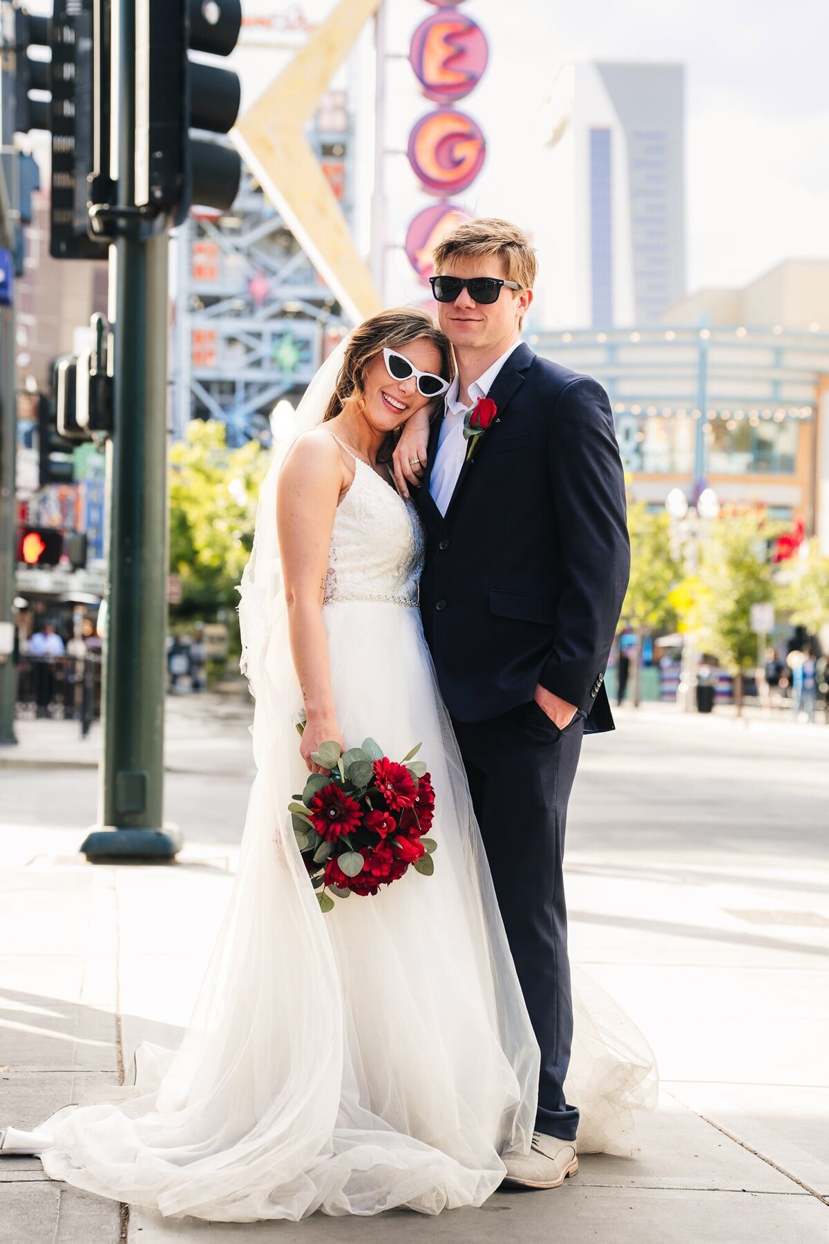 Lovely couple smiling while their photos are taken during their elopement in Las Vegas.