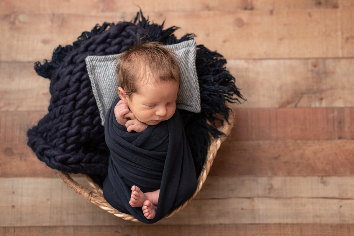 Picture of little boy wrapped in navy blue
