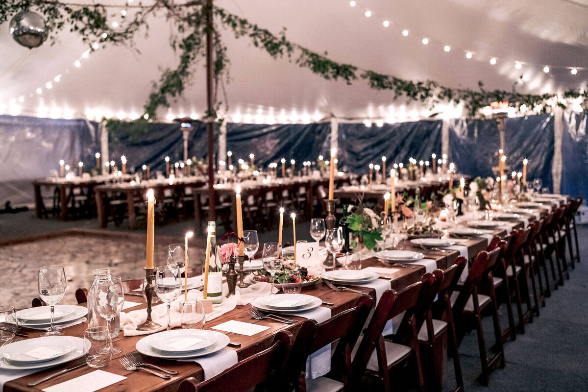 An elegant wedding reception set-up in a wedding tent in Foxfire Mountain House, New York. Wedding Image by Jenny Fu Studio