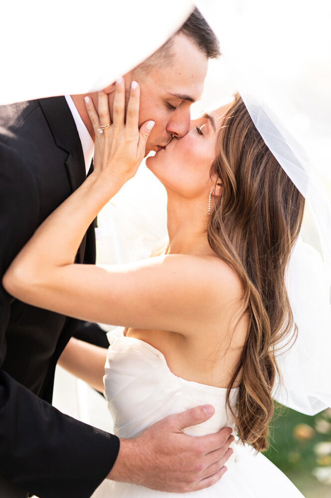 A bride and groom kissing