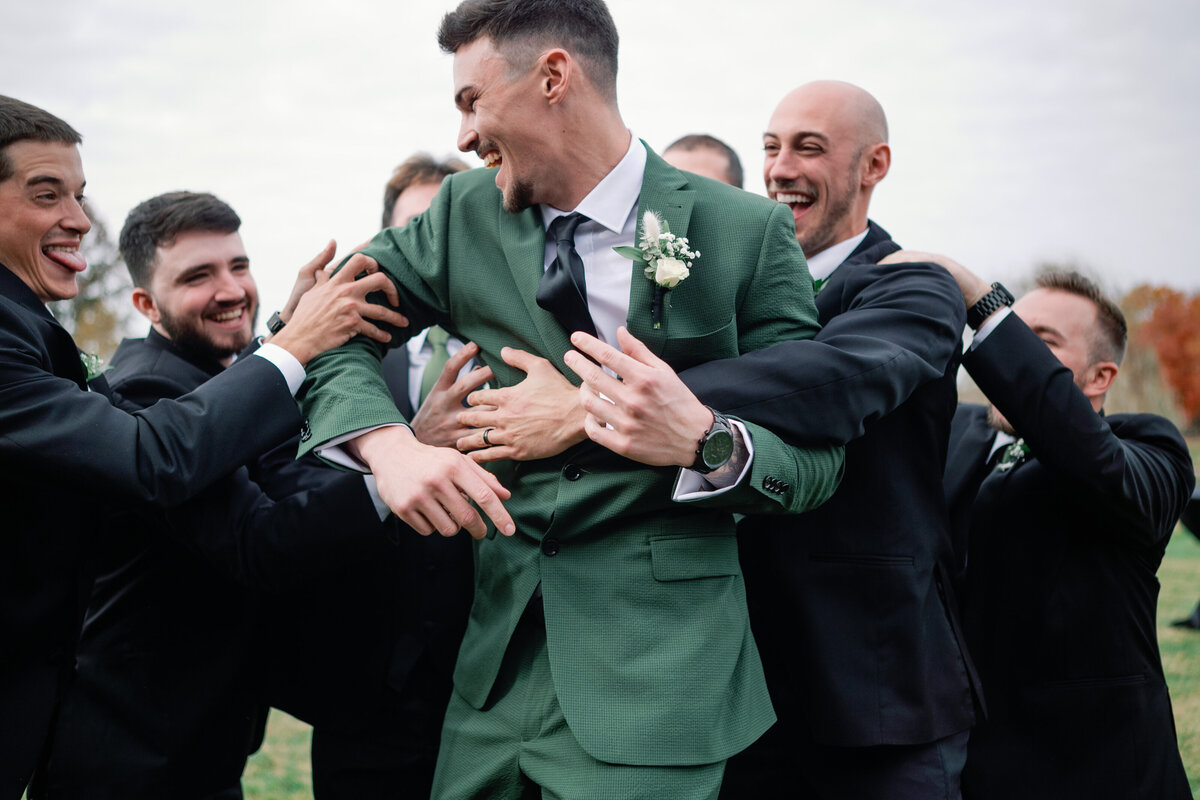 groomsmen hyping up the groom on his wedding day. photo by dc wedding photographer omar and company