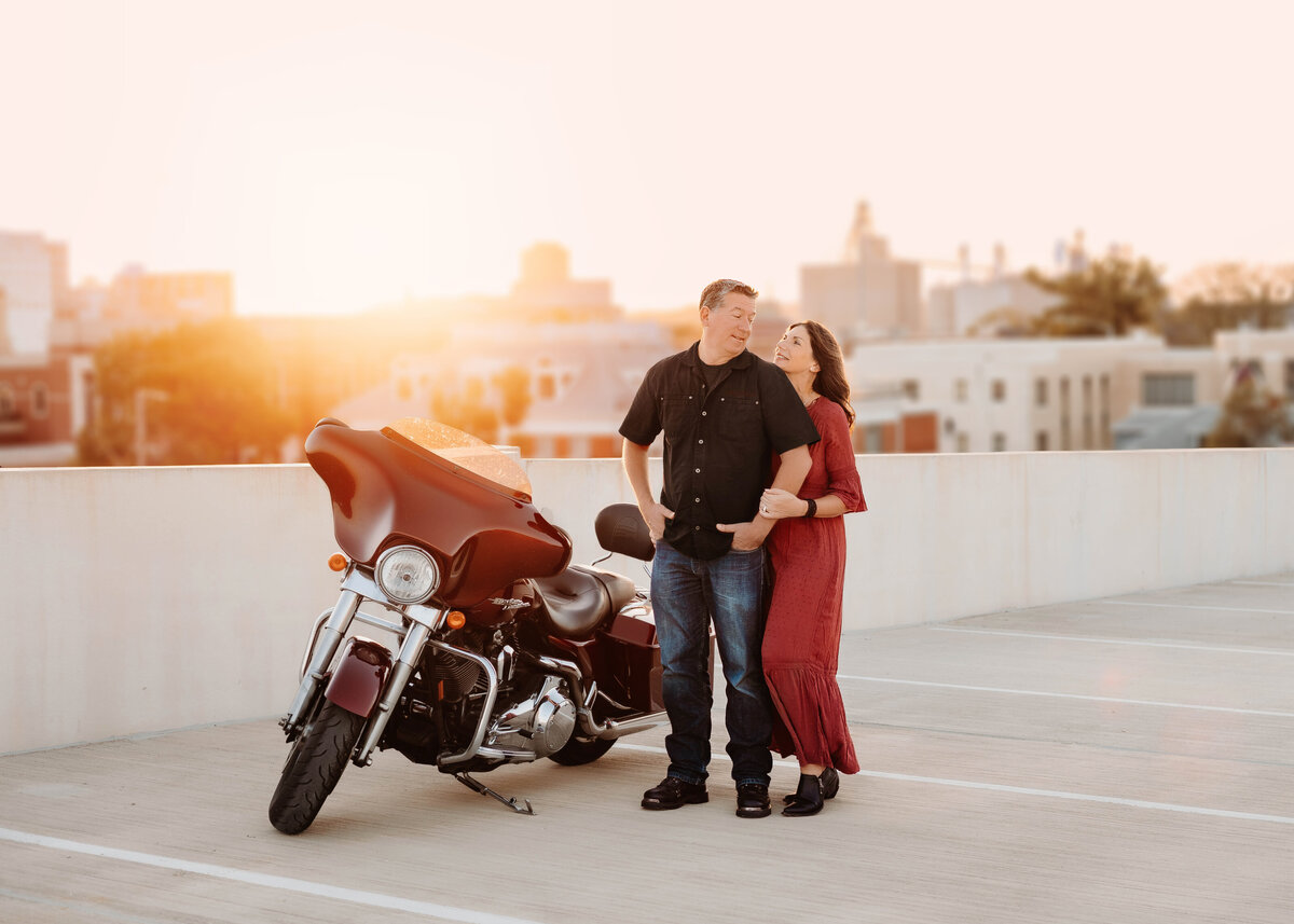 This couples poses on the rooftop of a parking garage in downtown Cedar Rapids.