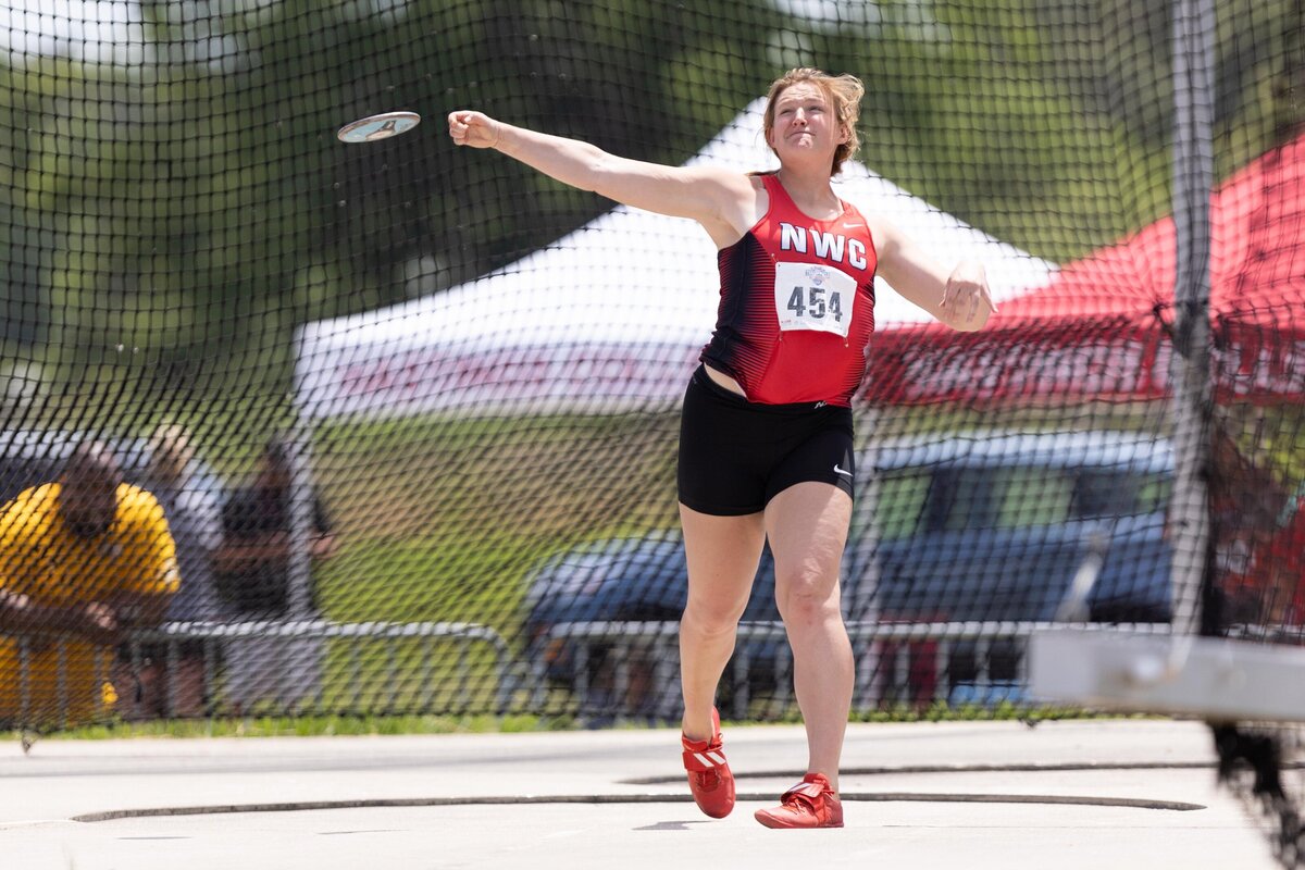 Northwestern College's Rebecca Bindert throws the discus on day 3 of the 2020 NAIA National Championship in Gulf Shores, Alabama.