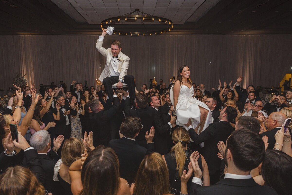 bride-groom-crowd-surfing-florida-reception