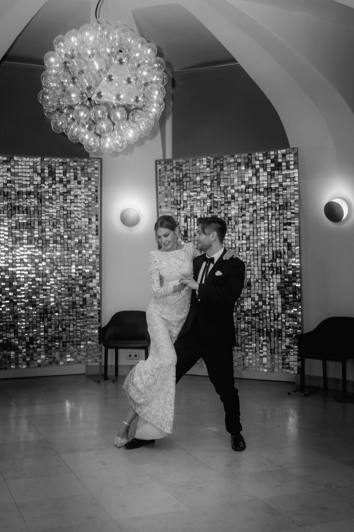 Bride and groom dance their first dance during wedding party.