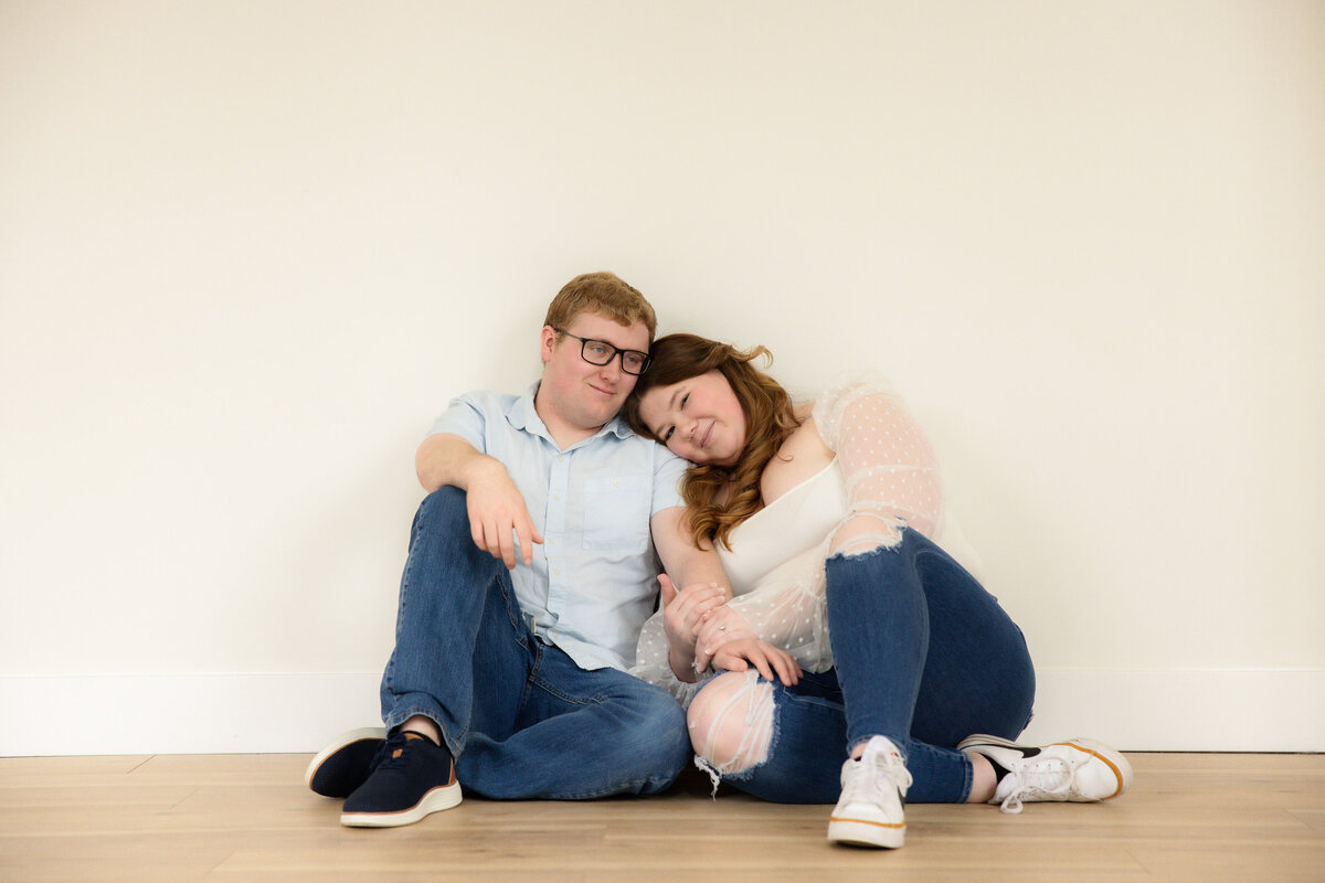 Couple with girl's head on boy's shoulder