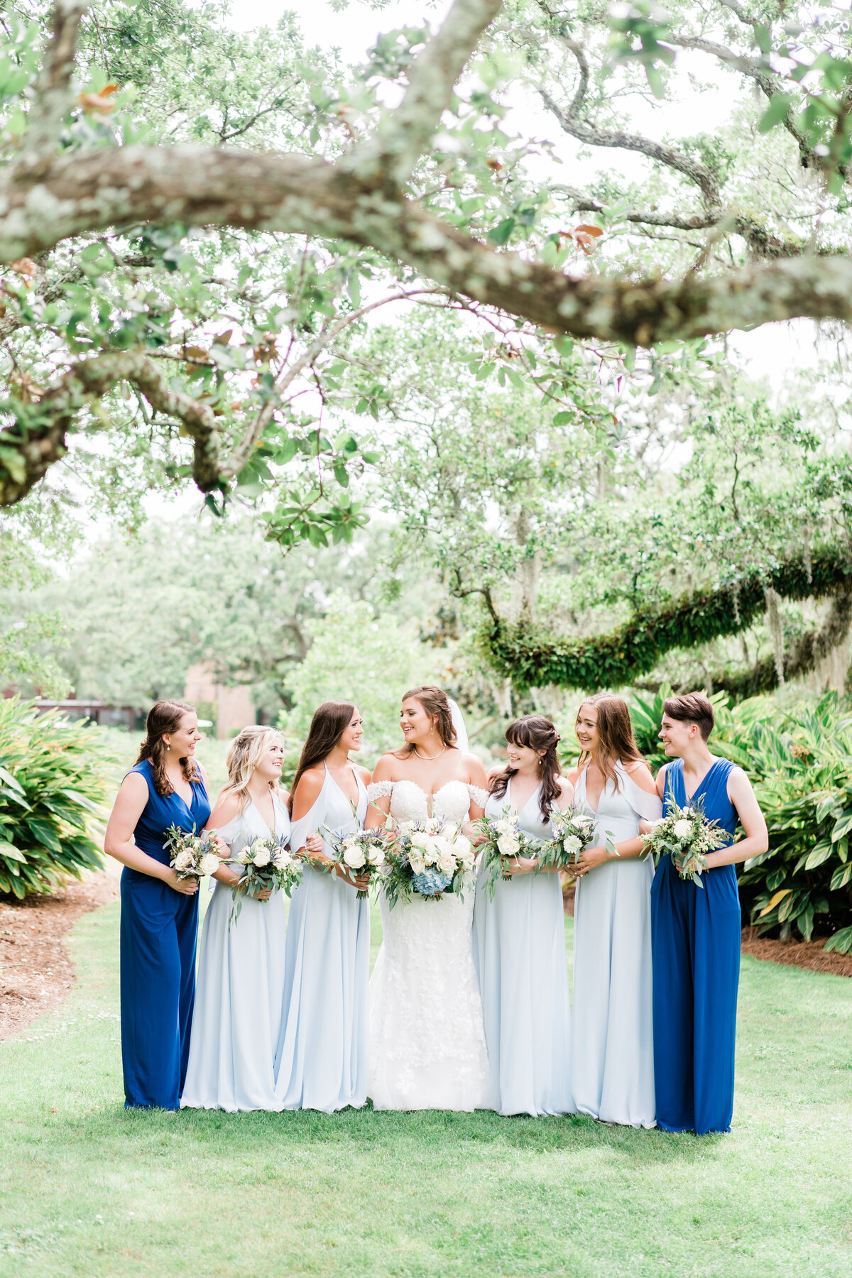 Bride with bridesmaids in blue