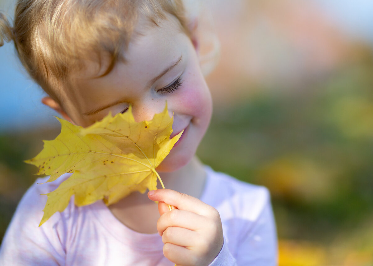 Girl smiling autumn leaf Canberra