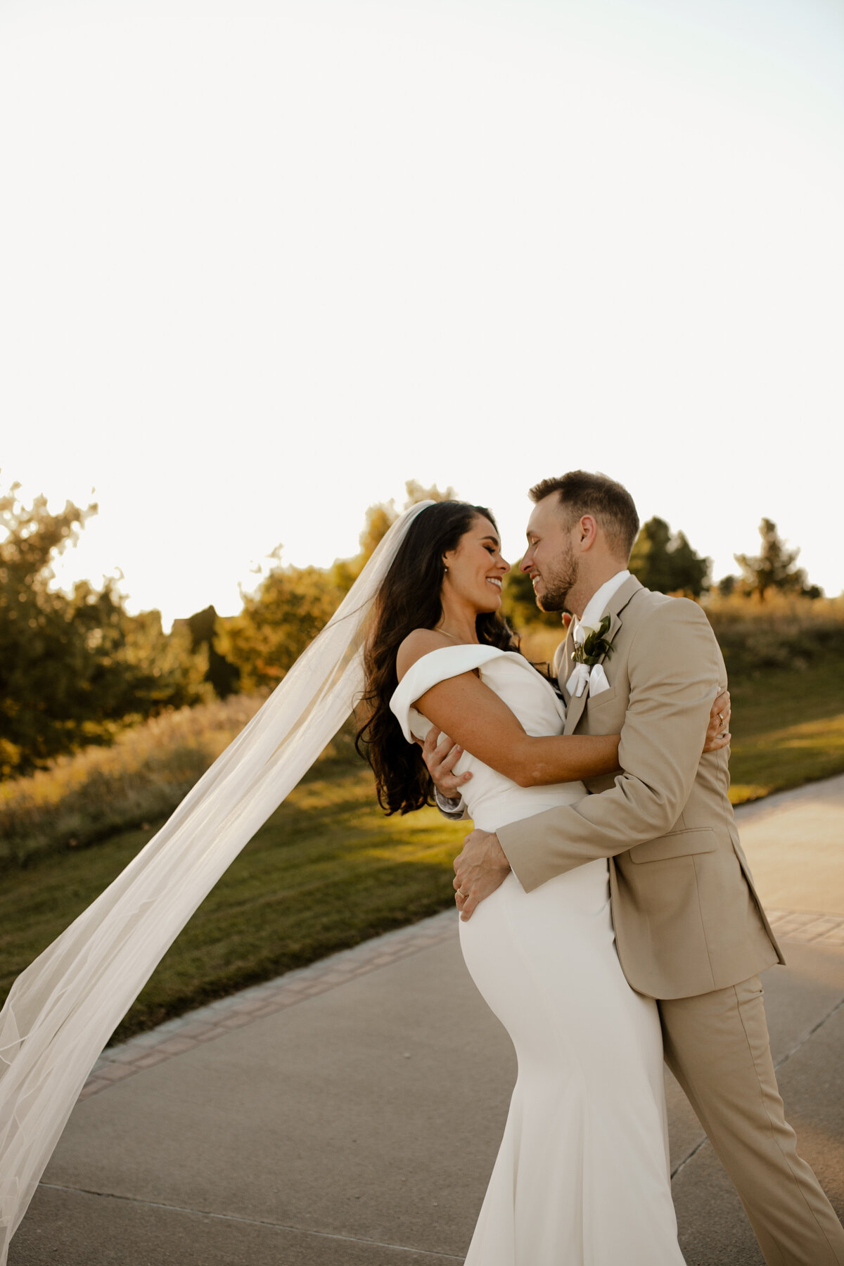 Elegant Bella Terre Vineyard wedding near Omaha, NE, blending luxury and rustic charm. Bride and groom celebrate amidst picturesque vineyard views and timeless architecture, captured by Tori Nichole Photography. A stunning setting for couples seeking a unique and sophisticated venue in the Omaha and Iowa region.