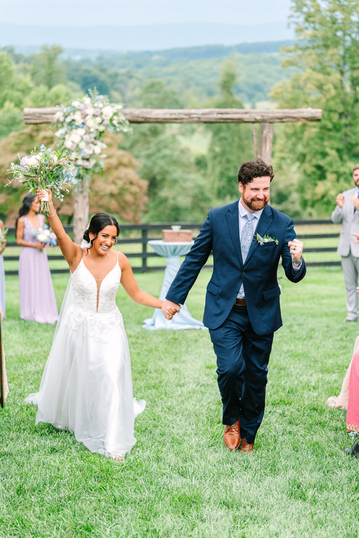 bride and groom smiling as they walk back down aisle