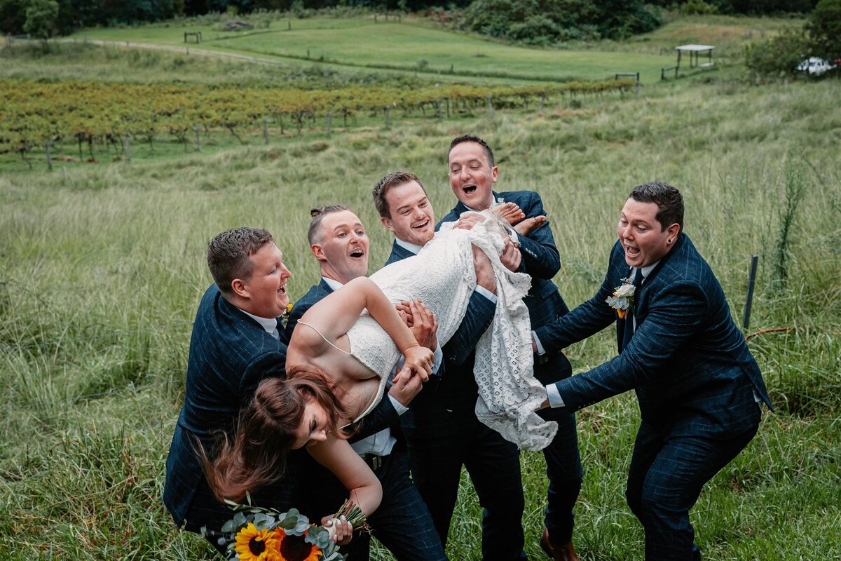 Kara & Ben together with their bridesmaids and groomsmen having a fun photoshoot!