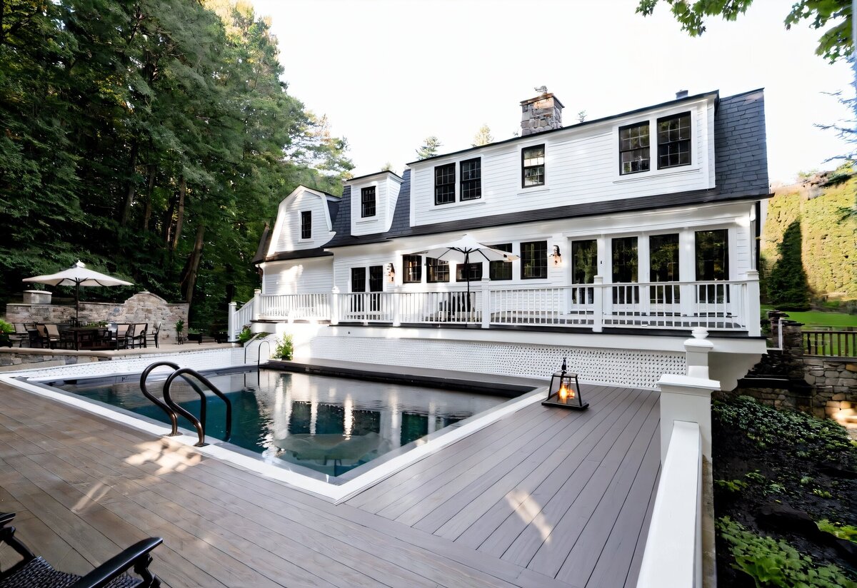 2024-02-07 17-41-03 - white siding, black windows, stone