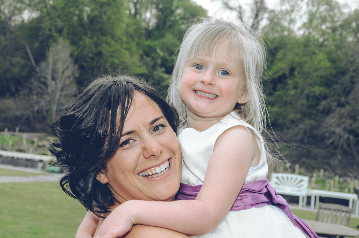 pro-story-photography_bridesmaid-with-flowergirl-happy-smiles_kitley-house_yealmpton_devon