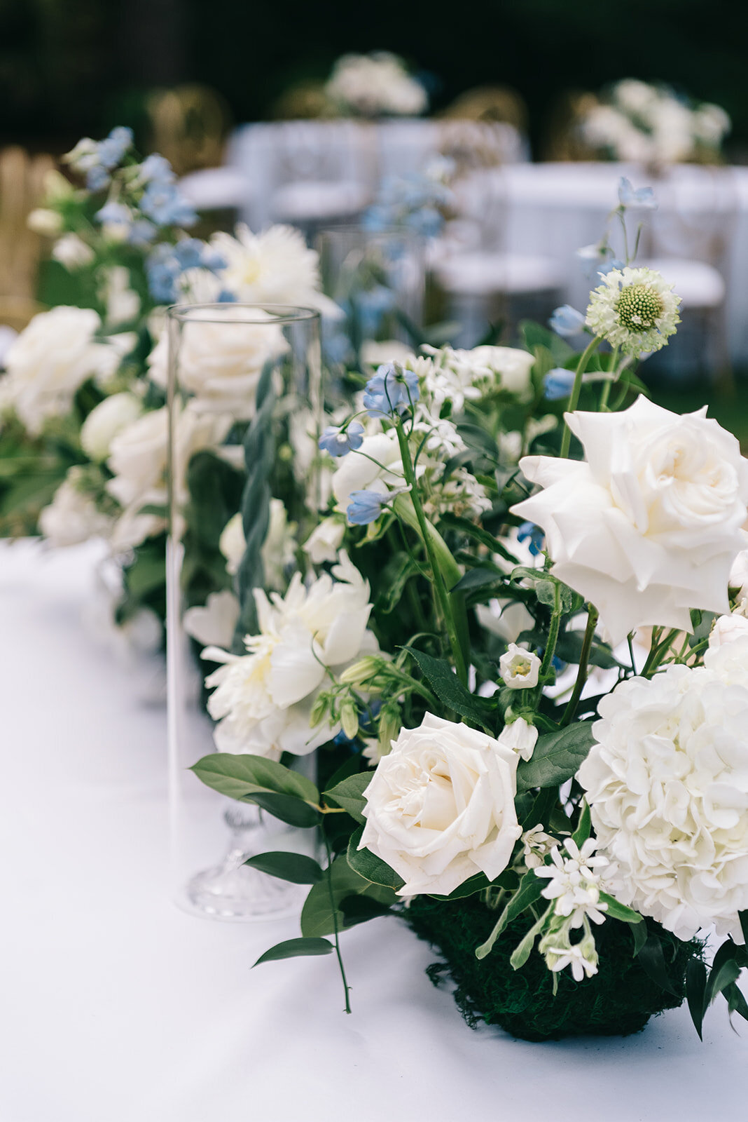 White and blue floral centerpieces designed by Abby Grace Florals at Greenville SC wedding