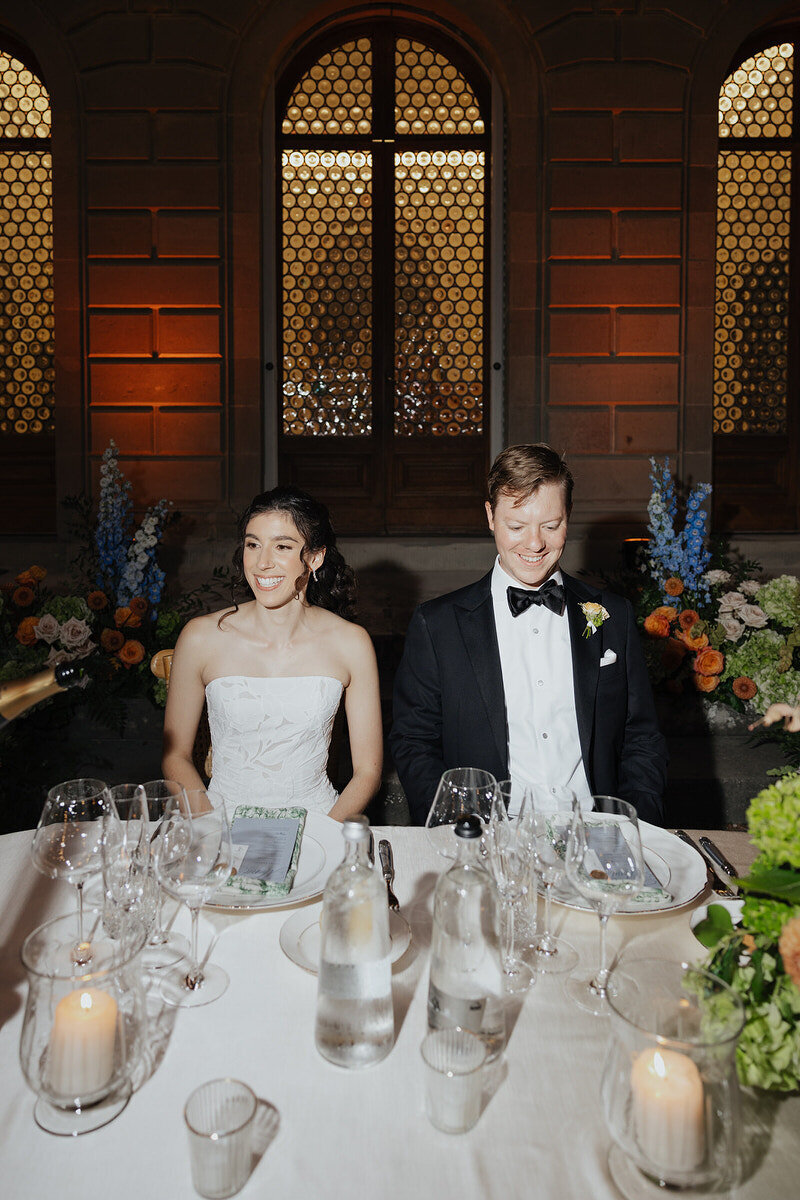 wedding-reception-bride-and-groom-at-table-laurianevega