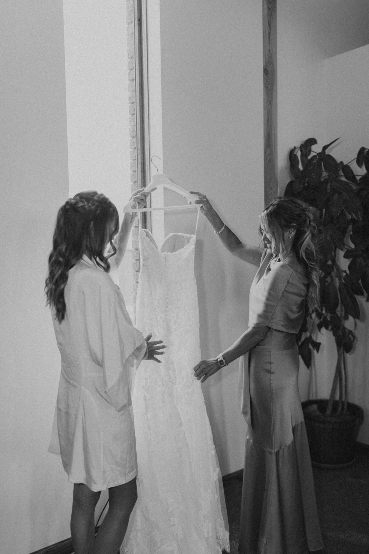 bride getting in dress